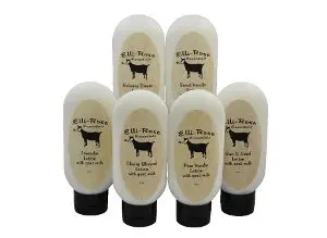 A group of six bottles of lotion with a cow on the front.