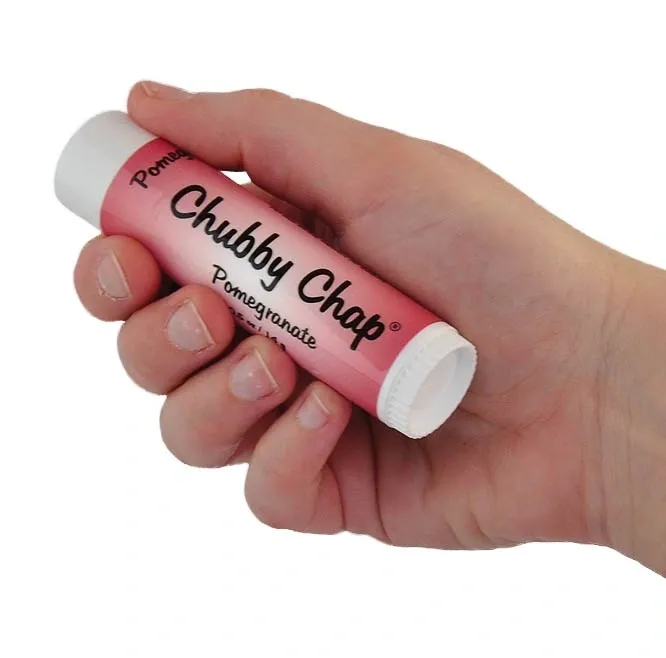 A hand holding a chubby chap lip balm.